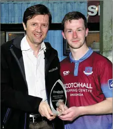  ?? Picture: Larry McQuillan ?? Luke Gallagher receives the Drogheda Independen­t Man of the Match award from Marcus Cavaroli.