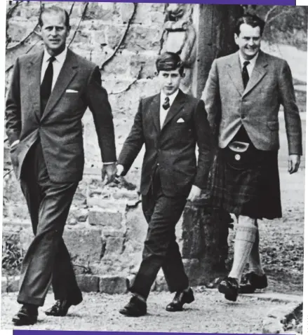  ??  ?? School of misery: Charles at Gordonstou­n with Prince Philip and school governor Iain Tennant