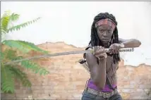  ?? Gene Page AMC ?? DANAI GURIRA takes an attack stance with her katana as Michonne, a fan- favorite character in “The Walking Dead.”