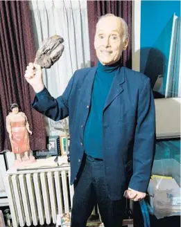  ?? SINNA NASSERI/THE NEW YORK TIMES ?? John Waters holds the rubber leg of lamb that Kathleen Turner used as a murder weapon in his movie “Serial Mom” on May 25 at his home in Baltimore.