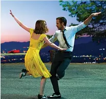  ?? Associated Press ?? n This image released by Lionsgate shows Ryan Gosling, right, and Emma Stone in a scene from "La La Land."