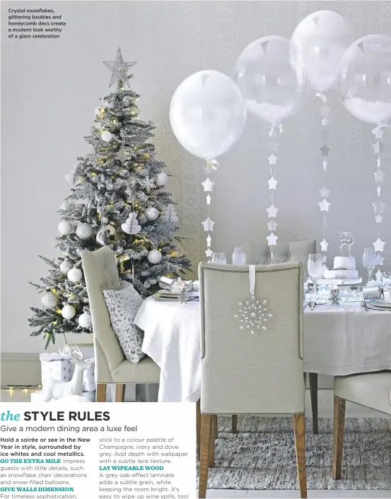  ??  ?? Crystal snowflakes, glittering baubles and honeycomb decs create a modern look worthy of a glam celebratio­n