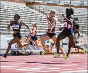  ?? RICARDO B. BRAZZIELL / AMERICAN-STATESMAN ?? Former Mississipp­i State star Erica Bougard (left) competes in the 200 meters as she takes the lead in the heptathlon with 3,740 points. Bougard now competes for Chula Vista Elite.