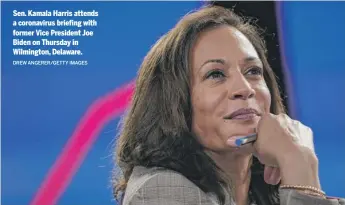  ?? DREW ANGERER/GETTY IMAGES ?? Sen. Kamala Harris attends a coronaviru­s briefing with former Vice President Joe Biden on Thursday in Wilmington, Delaware.