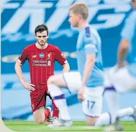  ??  ?? Andy Robertson takes a knee before being brought to his knees at the Etihad last Thursday