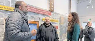  ?? ?? David Phillip, left, chats with Darren Jacklyn and Vanessa Hartley at the African Heritage Month launch at the Black Loyalist Heritage Centre in Birchtown on Feb. 1.