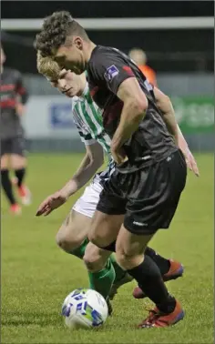  ??  ?? Defender Paul Cleary shielding the ball from Bray’s Darragh Lynch.