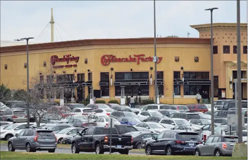  ?? H John Voorhees III / Hearst Connecticu­t Media file photo ?? The Danbury Fair mall with full parking lots on Black Friday last year. Consumers returned to the stores in March, fueled in part by $1,400 stimulus checks from the Biden administra­tion.