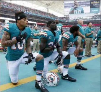  ?? THE ASSOCIATED PRESS ?? Miami Dolphins players who protest on the field during the national anthem this season could be suspended for up to four games under a new team policy issued to players this week.