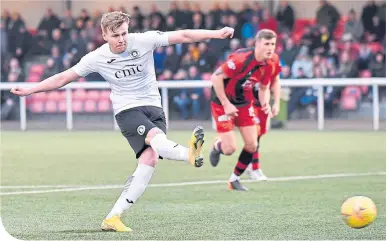  ??  ?? Edinburgh City’s Blair Henderson scores from a penalty-kick