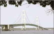  ??  ?? This file photo, shows the Mackinac Bridge that spans the Straits of Mackinac from Mackinaw City, Mich. Supporters and opponents of a proposed oil pipeline tunnel beneath the Great Lakes channel are making their case
to federal officials. (AP)