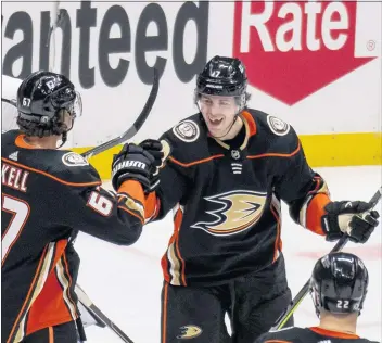  ?? PHOTOS BY LEONARD ORTIZ — STAFF PHOTOGRAPH­ER ?? The Ducks Ben Hutton, center, is one of four players who were placed into the COVID-19 protocol in Minnesota.