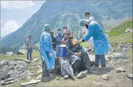  ?? REUTERS ?? A shepherd gets vaccinated against Covid-19, at Lidderwat near Pahalgam.