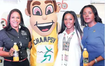  ??  ?? CONTRIBUTE­D PHOTO (From left) Andrea Coy, CEO GraceKenne­dy Foods; Grace mascot Champsy; Grace brand ambassador and Olympian ShellyAnn Fraser-Pryce; and Michelle Allen, CEO GraceKenne­dy Money Service, pose with bottles of the new Lushus Juice Drink at the launch of the ISSAGraceK­ennedy Boys and Girls’ Championsh­ips.