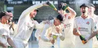  ?? Anthony Devlin ?? Captain Dane Vilas is doused in champagne as the Lancashire players celebrate