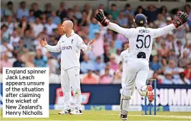  ?? ?? England spinner Jack Leach appears unsure of the situation after claiming the wicket of New Zealand’s Henry Nicholls