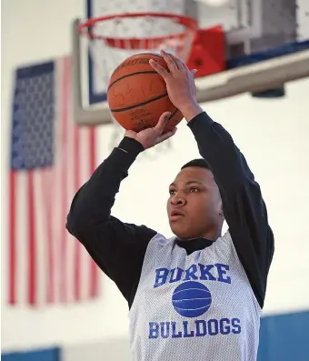  ?? MATT STONE / BOSTON HERALD ?? ON TARGET: Burke’s Levar Williams goes up for a shot during practice on Monday.