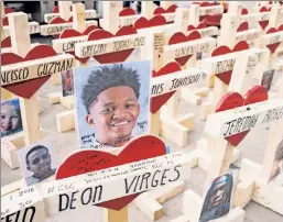  ??  ?? Their lives mattered: Over 750 wooden crosses on Michigan Avenue in Chicago serve as a memorial to lives lost to violence in the city in 2016.