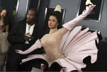  ?? Jordan Strauss/Invision/AP ?? Offset, left, and Cardi B arrive at the 61st annual Grammy Awards at the Staples Center on Sunday in Los Angeles. Cardi B won a grammy for best rap album.