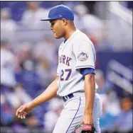  ?? Lynne Sladky / Associated Press ?? New York Mets relief pitcher Jeurys Familia walks to the dugout after being relieved in the eighth inning against the Miami Marlins on Thursday in Miami. The Marlins won 4-2.