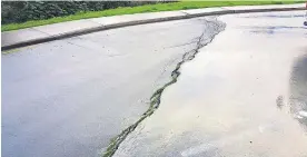  ??  ?? A photo taken on September 4 shows the cracks in the carpark. Auckland Transport did not fence the area until part of it had collapsed.