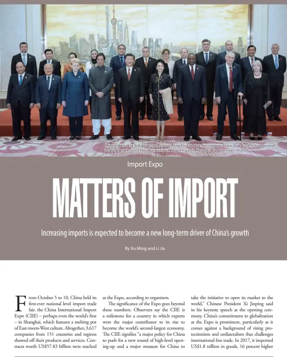  ??  ?? Chinese President Xi Jinping and his wife Peng Liyuan pose for a group photos with leaders from around the world at the first China Internatio­nal Import Expo in Shanghai on November 4, 2018