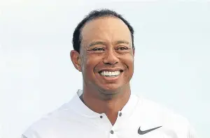  ?? Picture: Getty. ?? Tiger Woods had plenty to smile about after following his opening 69 with a 68 on his competitiv­e comeback in the Hero Challenge.