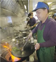  ?? NICK PROCAYLO FILES ?? The head of the B.C. Restaurant and Foodservic­e Associatio­n says a plan to eliminate the use of natural gas in Vancouver is particular­ly concerning for the city’s profession­al wok cooks.