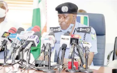  ??  ?? Mohammed Adamu, inspector general of Police, addressing a news conference to disband the Federal Special Anti Robbery Squad (FSARS) and fresh measures on fighting crime, in Abuja, at the weekend. NAN