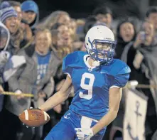  ?? PAUL CONNORS / BOSTON HERALD ?? IT’S SIX: Receiver Max Roche scores his second touchdown of the game.