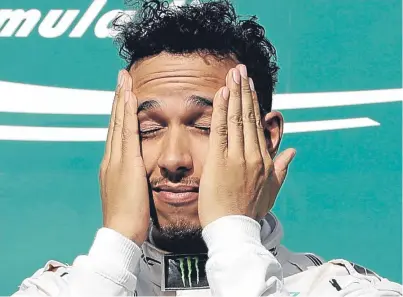  ?? Picture: AP. ?? F1 world champion Lewis Hamilton, above, is 26 points behind championsh­ip leader and Mercedes team-mate Nico Rosberg with just three races remaining.