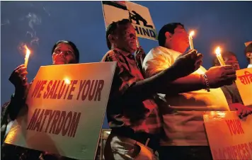  ??  ?? People hold candles and placards during a vigil for the soldiers who were killed after gunmen attacked an Indian army base in Kashmir’s Uri on Sunday, in Mumbai, India, September 19, 2016. REUTERS/Danish Siddiqui