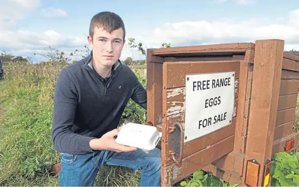  ??  ?? DISAPPOINT­ED: Fraser Dandie had his honesty box and eggs stolen from the road near Hatton of Carse Farm in Angus. Picture by Gareth Jennings.