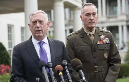  ??  ?? Defence secretary James Mattis (left) said North Korea would face a ‘massive military response’.