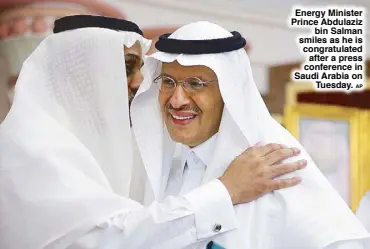  ?? AP ?? Energy Minister Prince Abdulaziz bin Salman smiles as he is congratula­ted after a press conference in Saudi Arabia on Tuesday.