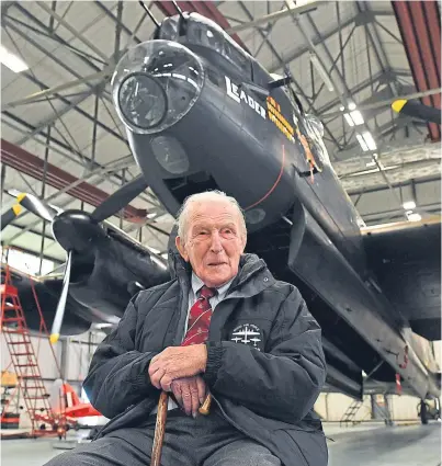  ?? PA. ?? Dam Busters survivor George ‘Johnny’ Johnson and a Lancaster bomber at RAF Coningsby.