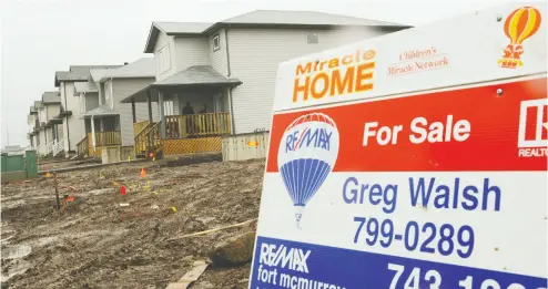  ?? MARK RALSTON / AFP VIA GETTY IMAGES FILES ?? High unemployme­nt has led to a higher rate of mortgage deferrals and mortgages in arrears in Alberta than elsewhere in Canada, and economists warn there could be more turmoil ahead in the province’s housing market.