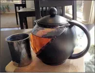  ?? Arkansas Democrat-Gazette/JENNIFER NIXON ?? Pots of tea at Abbi’s Teas &amp; Things come with a bag for additional steeping and can fill four cups to share or enjoy solo.