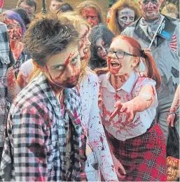  ??  ?? Getting in the spirit of things on a previous zombie walk. This year’s event will raise funds for Dundee Foodbank.