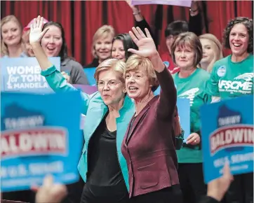  ?? STEVE APPS THE ASSOCIATED PRESS ?? Sen. Tammy Baldwin of Wisconsin, right, a Democrat running for re-election, is supported by Sen. Elizabeth Warren of Massachuse­tts at the Women for Tammy rally in Madison, Wis., on Friday.