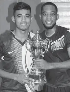  ??  ?? Shemar Britton and Yeudister Persaud teamed up to win a recent teams’ table tennis tournament.