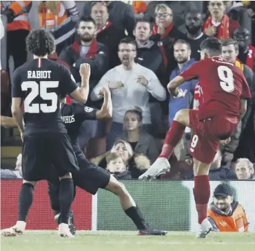  ?? PICTURE: JULIAN FINNEY/GETTY ?? Substitute Roberto Firmino fires home Liverpool’s added-time winner.