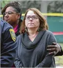  ?? Yi-Chin Lee / Staff photograph­er ?? HISD Interim Superinten­dent Grenita Lathan, left, consoles Lamar High School Principal Rita Graves during Tuesday’s news conference.