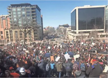  ?? JASON STEIN / MILWAUKEE JOURNAL SENTINEL ?? Students gather at the Wisconsin State Capitol on Wednesday as part of the National School Walkout.