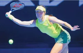  ?? RICK RYCROFT/ASSOCIATED PRESS ?? Jessica Pegula reaches for a forehand during her straight-sets Australian Open victory Tuesday over Victoria Azarenka, a two-time champion at the event.