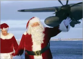  ?? MARK THIESSEN — THE ASSOCIATED PRESS ?? This photo shows Santa Claus and Mrs. Claus arriving at Saint Michael, Alaska, a remote island community off Alaska’s western coast.