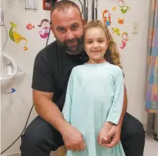  ?? SUPPLIED ?? Ali Mansour and daughter Mariam during her recent stay in hospital.