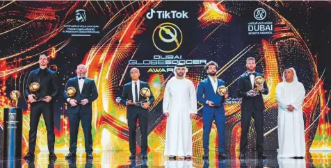  ?? Twitter ?? Shaikh Mansoor with the winners of the 13th edition of the Dubai Globe Soccer Awards held on the sidelines of the 17th Dubai Internatio­nal Sports Conference at Madinat Jumeirah in Dubai yesterday.