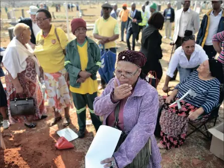  ??  ?? PAINFUL: Mangi Mmoni cries during the exhumation of the remains of her father, Richard Motsoahae, at Mamelodi West Cemetery yesterday.