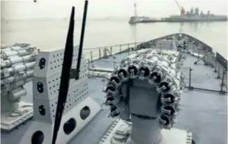  ??  ?? INS Kochi’s RBU-6000 anti-submarine rocket launcher, LR-SAM and Brahmos vertical launch cells, and 76mm main gun visible from the bridge, while its sister ship is seen moored in the distance